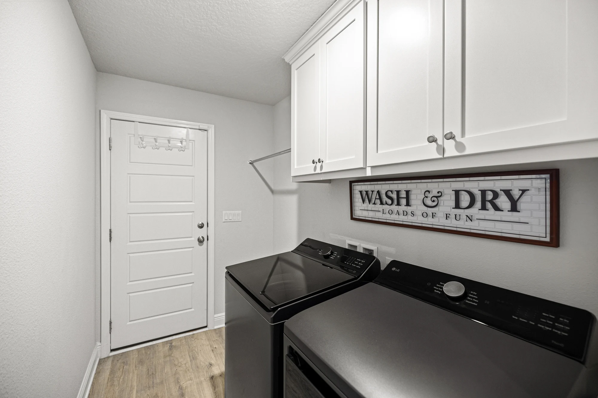 Laundry room after by Joy Signature Designs