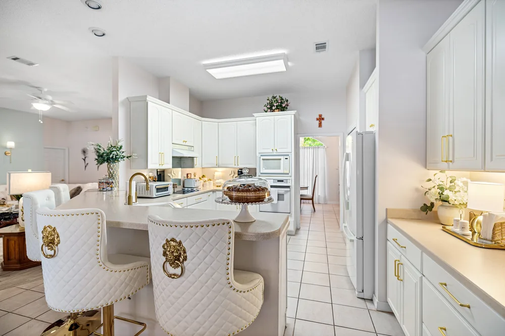 Open kitchen layout design by Joy Signature Designs