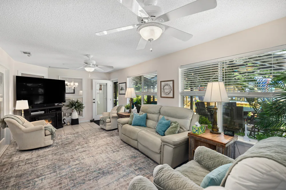 Open concept living room design by Joy Signature Designs