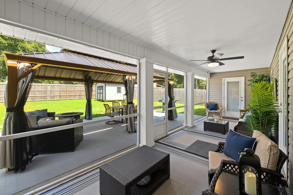 Porch lounge area by Joy Signature Designs